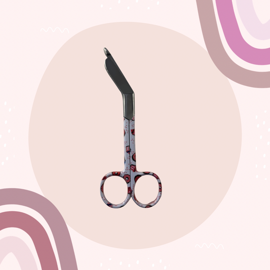 Sweet treats lister bandage scissors with curved handle and blunt safety tip. 
