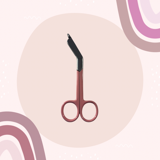 pink lister bandage scissors with curved handle and blunt safety tip. 